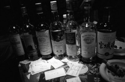 Photo: “Whiskey bottles in midnight light.”